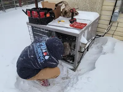 Fixy HVAC technician servicing package unit Wichita KS